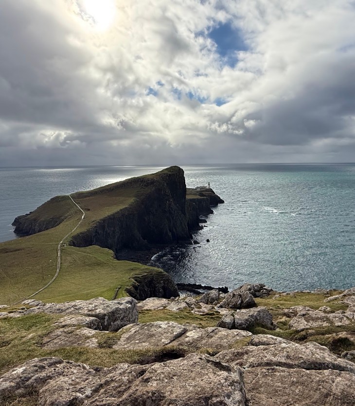 promentory in Scotland with a lighthouse surrounded by water